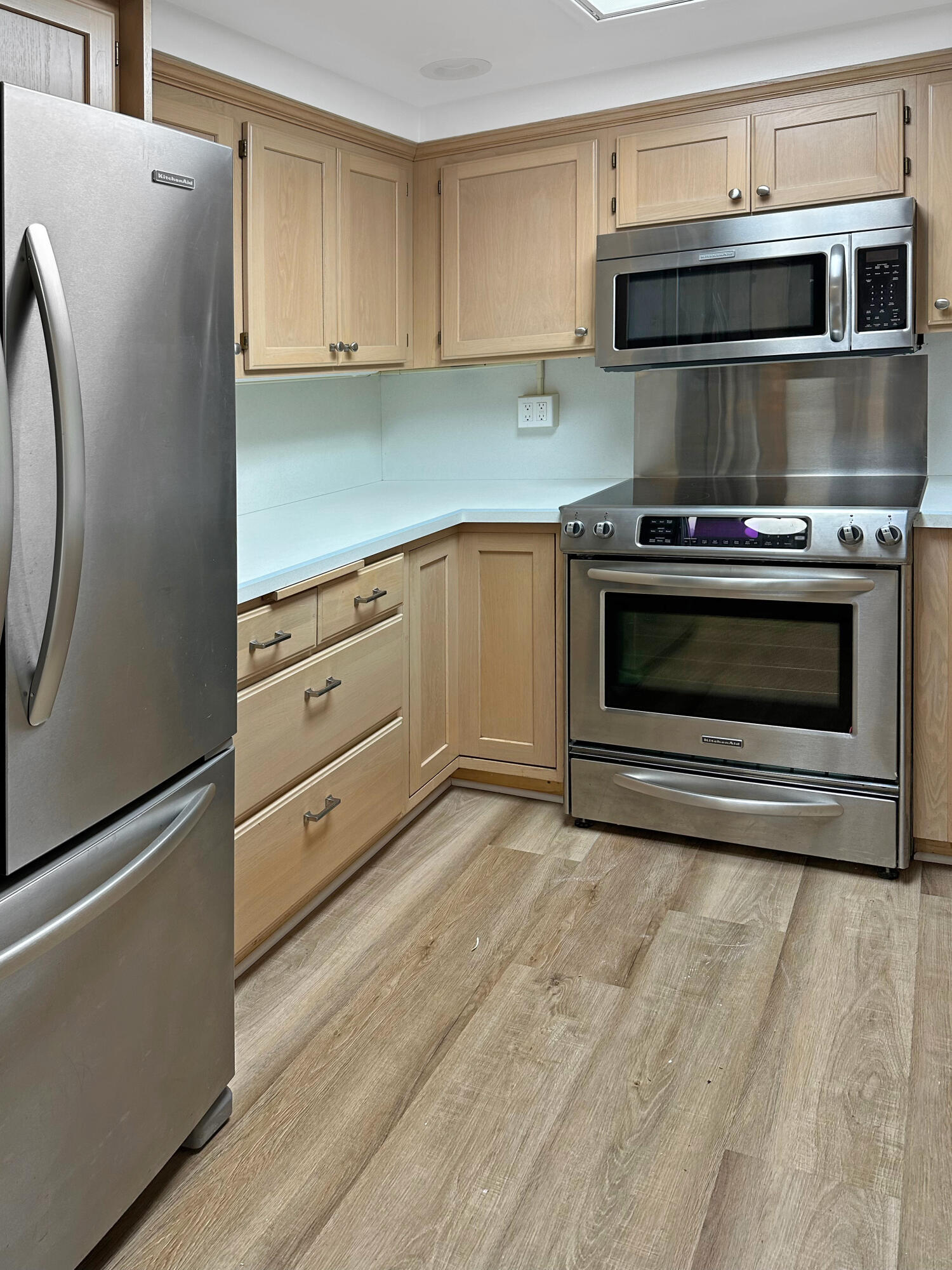 5740 Encina Road, Unit 3 Goleta, CA 93117 - Photo 9 of 23 a kitchen with granite countertop white cabinets and stainless steel appliances
