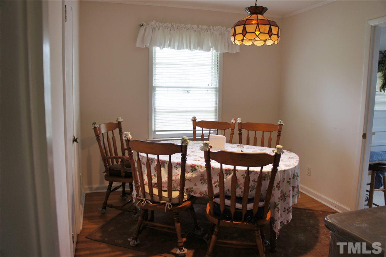 2832 Poole Road Raleigh, NC 27610 - Photo 8 of 16 a view of a dining room with furniture and window