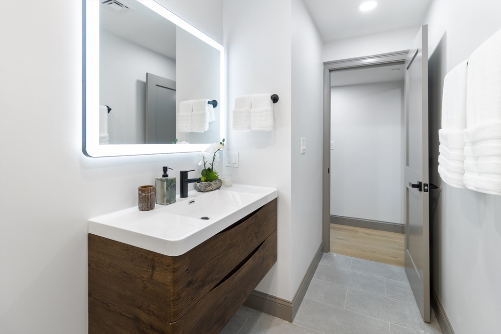 4 Snelling Place, Unit 4 Boston, MA 02113 - Photo 14 of 15 a bathroom with a sink vanity and a mirror