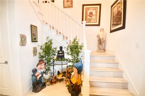 a bath room with a sink vanity granite and a large mirror