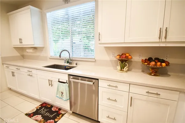 an aerial view of a house with a yard and sitting area
