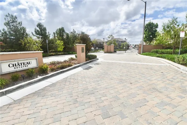 a kitchen with stainless steel appliances kitchen island granite countertop a sink and cabinets
