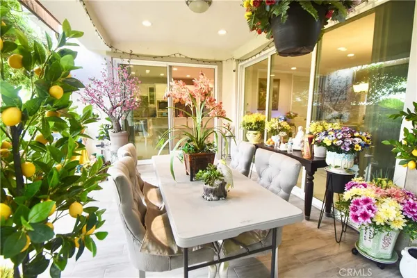 a dining room with furniture and wooden floor