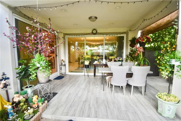 a kitchen with stainless steel appliances kitchen island granite countertop a sink cabinets and window
