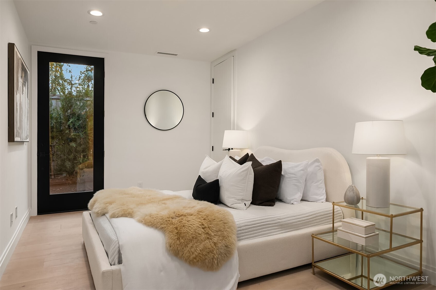 7626 Northeast 10th Street Medina, WA 98039 - Photo 16 of 40 a bedroom with a bed and a window