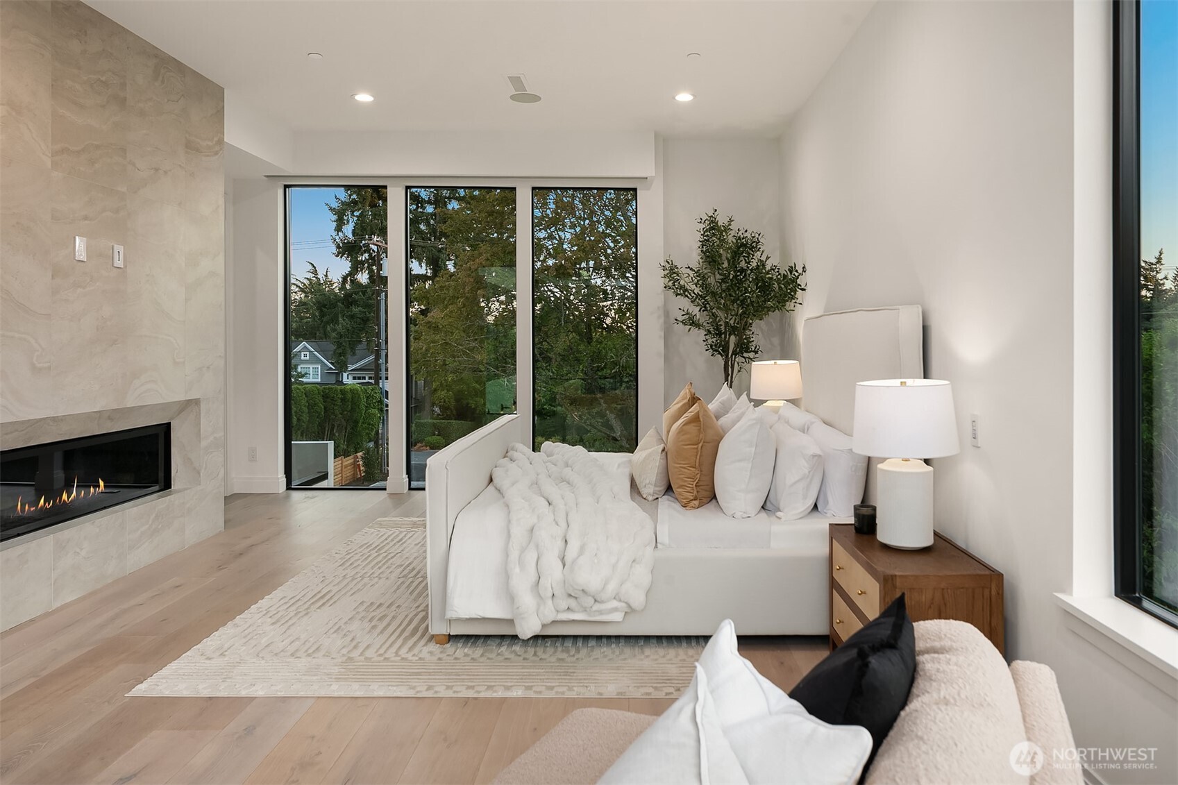 7626 Northeast 10th Street Medina, WA 98039 - Photo 20 of 40 a bedroom with furniture and a fireplace