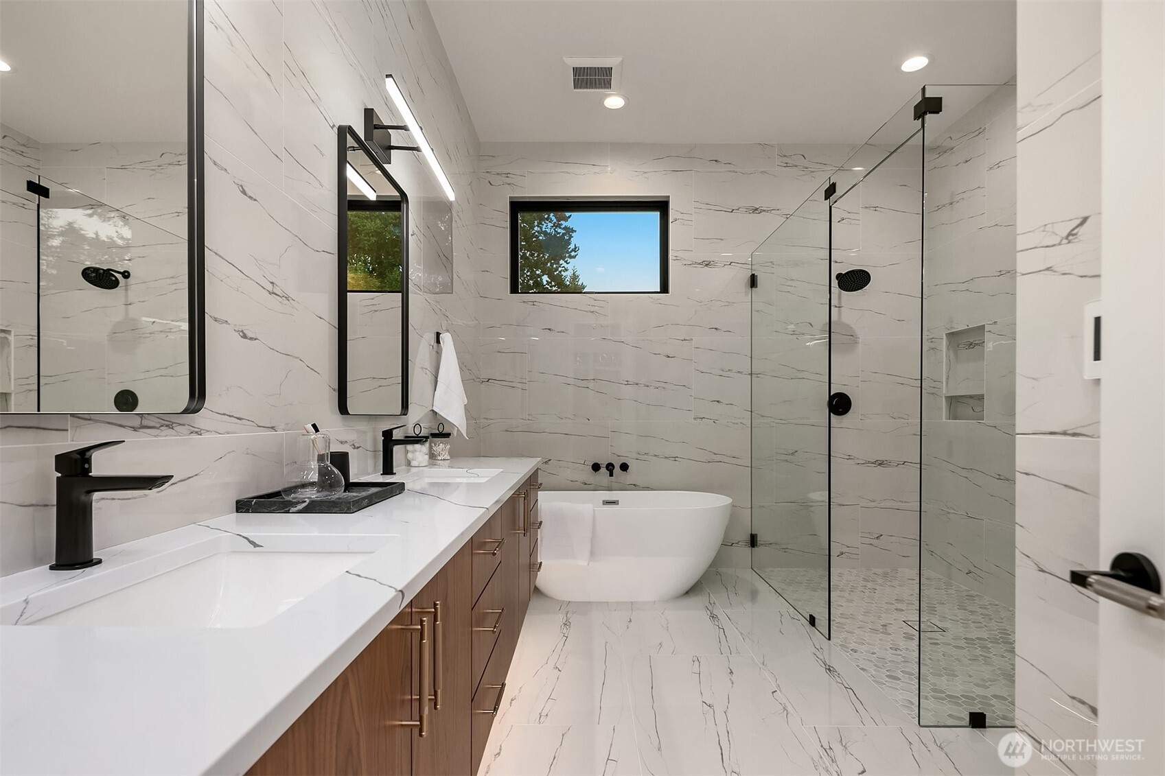 7626 Northeast 10th Street Medina, WA 98039 - Photo 25 of 40 a bathroom with a double vanity sink toilet and shower