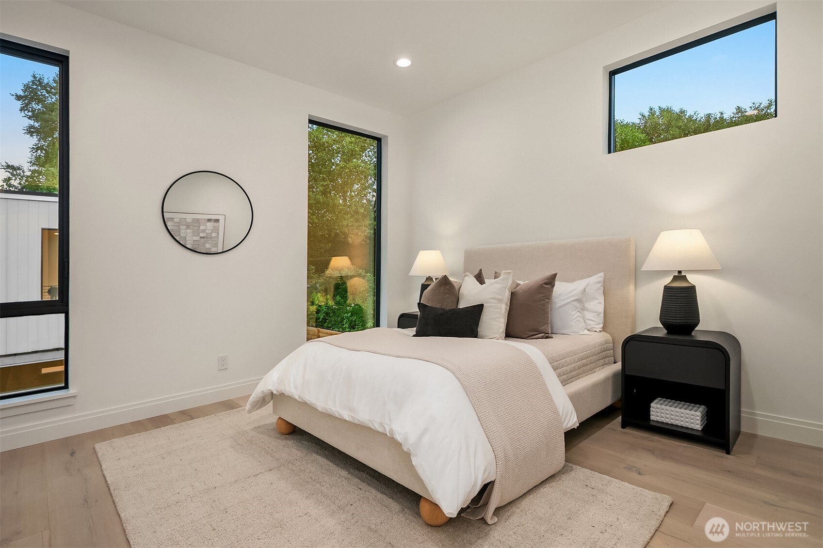 7626 Northeast 10th Street Medina, WA 98039 - Photo 29 of 40 a bedroom with bed and a painting on the wall