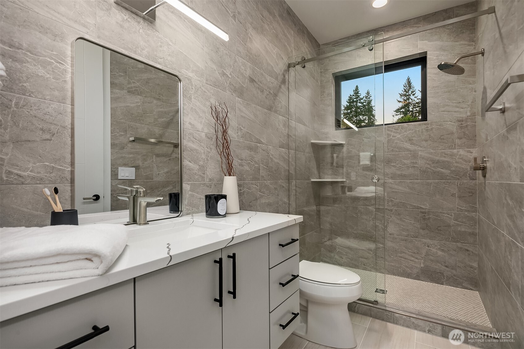 7626 Northeast 10th Street Medina, WA 98039 - Photo 33 of 40 a bathroom with a sink a toilet and shower