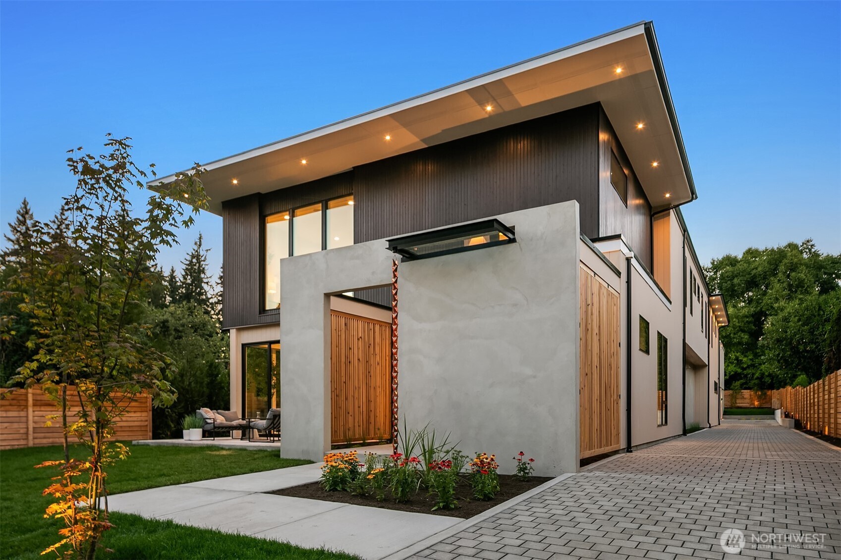 7626 Northeast 10th Street Medina, WA 98039 - Photo 40 of 40 a front view of a house with garden