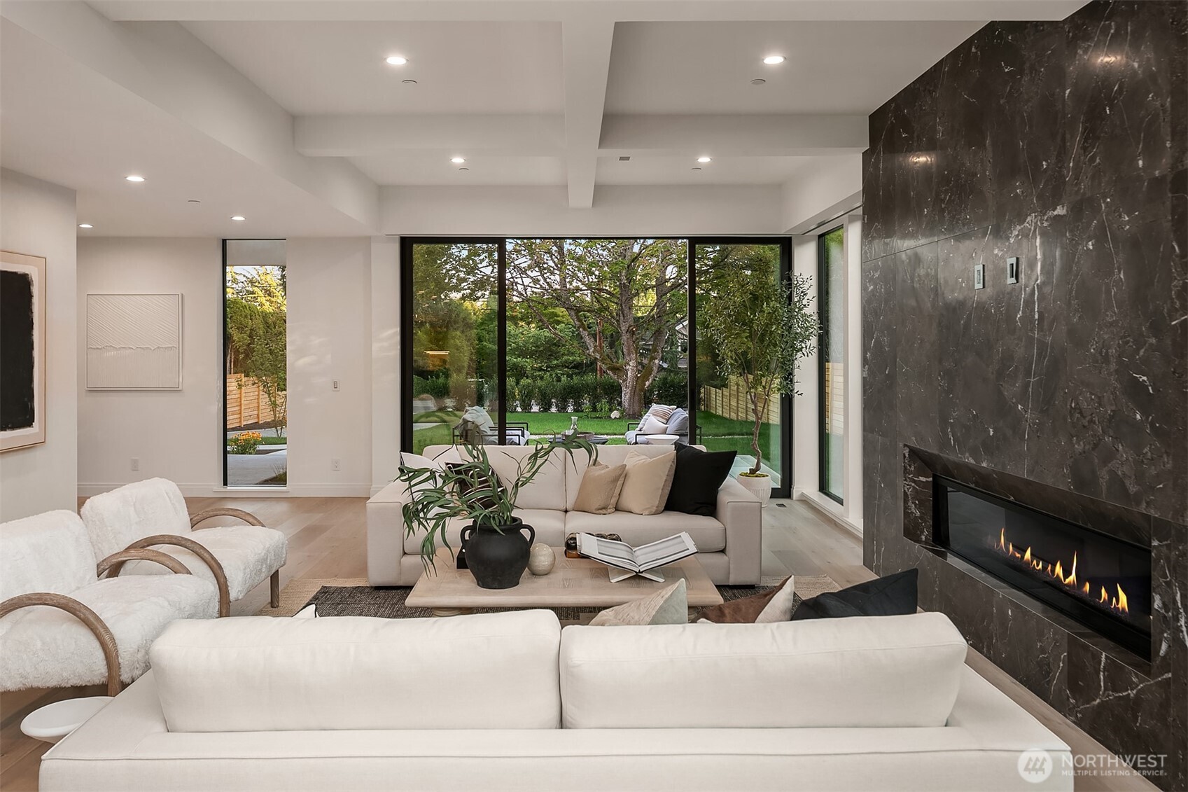 7626 Northeast 10th Street Medina, WA 98039 - Photo 6 of 40 a living room with furniture and a floor to ceiling window