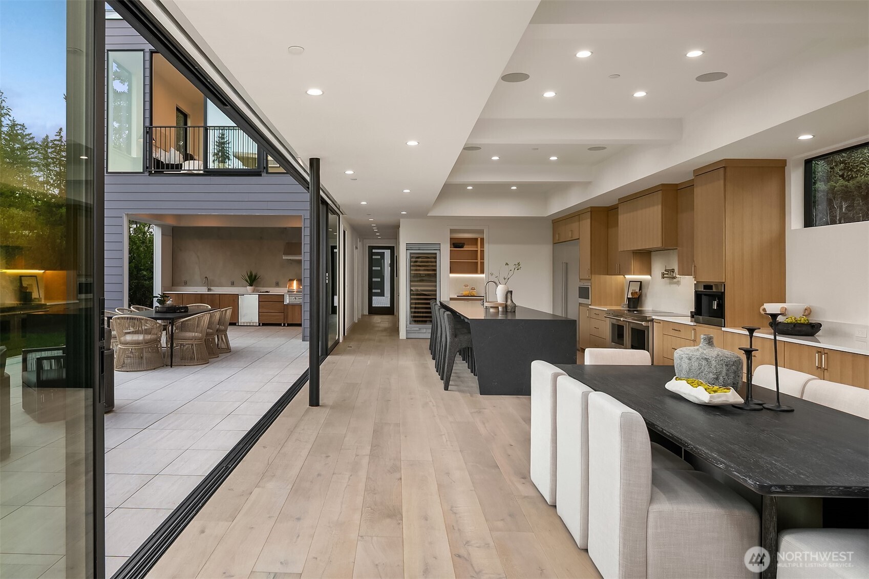 7626 Northeast 10th Street Medina, WA 98039 - Photo 8 of 40 a living room with stainless steel appliances furniture a rug kitchen view and a large window
