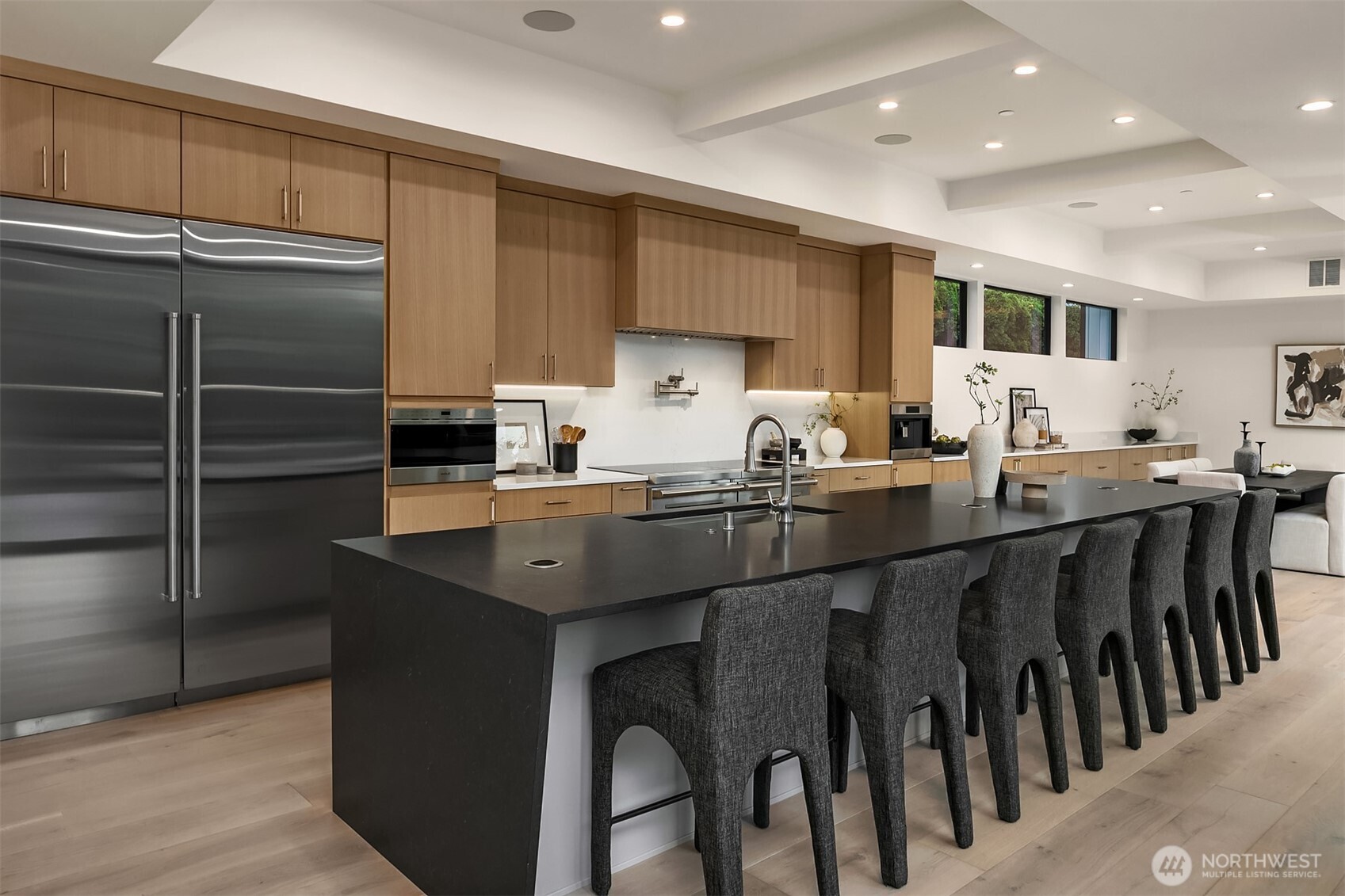 7626 Northeast 10th Street Medina, WA 98039 - Photo 10 of 40 a kitchen with kitchen island granite countertop a sink and cabinets