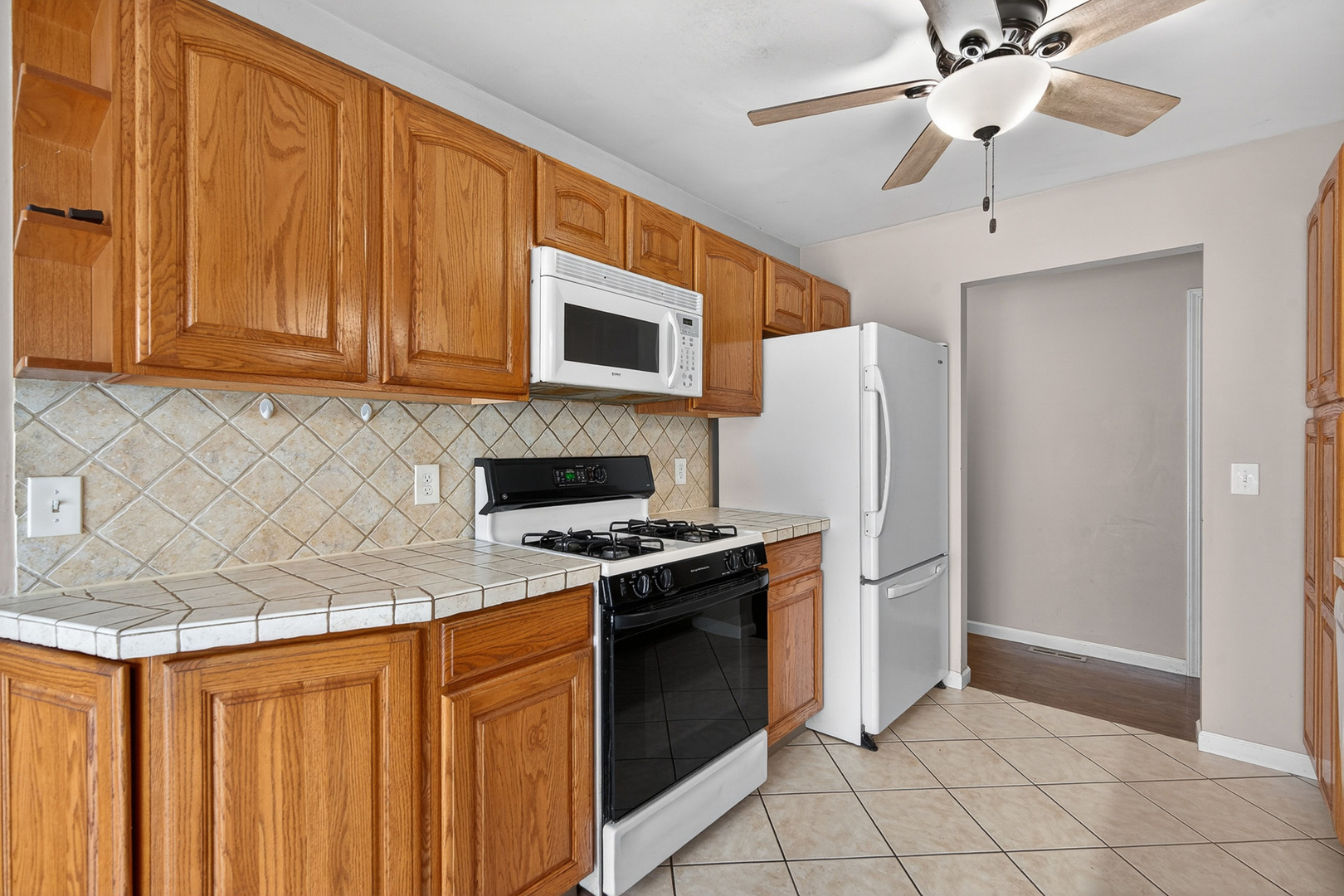 73 Ingleshire Road Montgomery, IL 60538 - Photo 8 of 22 a kitchen with stainless steel appliances granite countertop a refrigerator oven a sink dishwasher and a stove