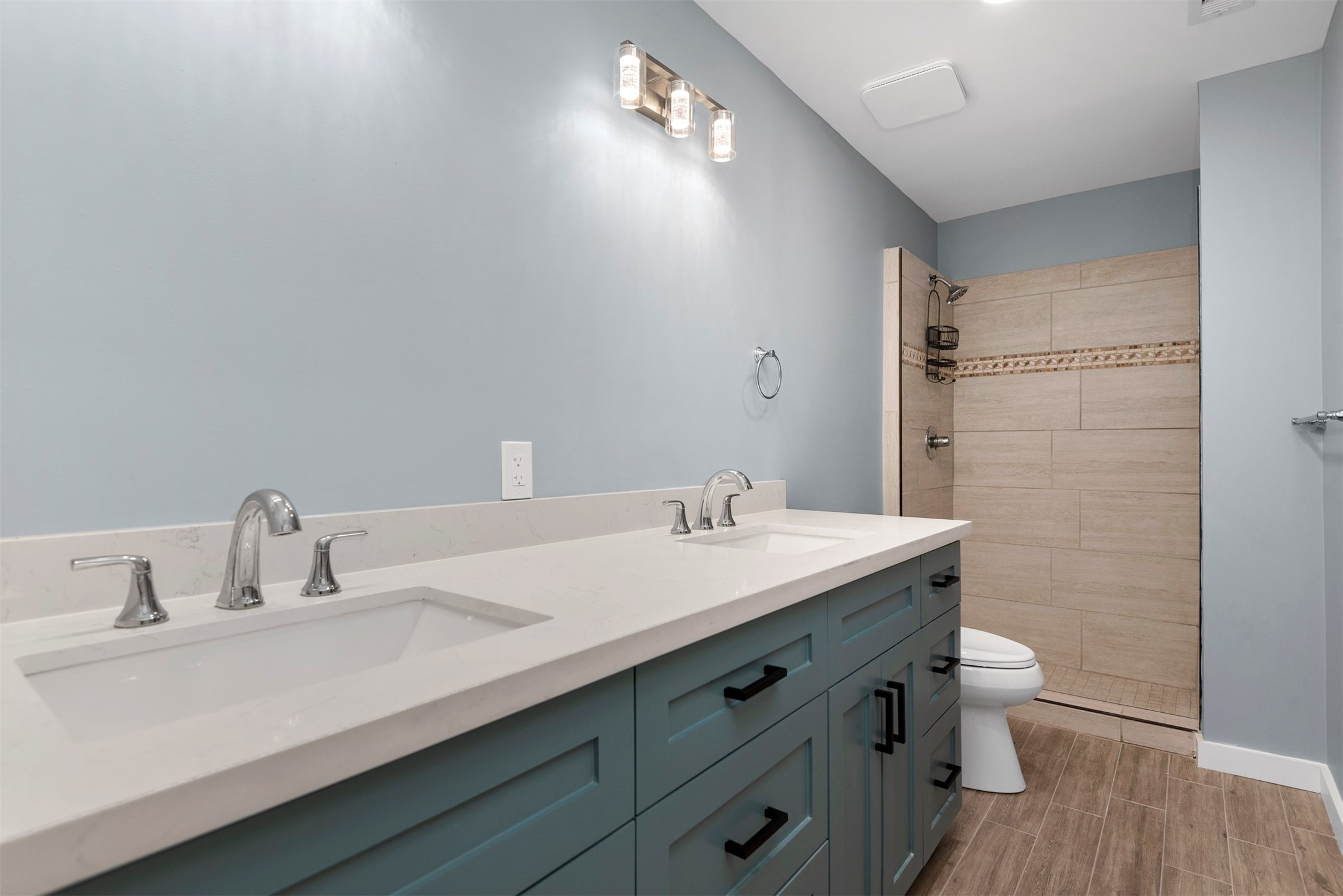 5000 Milwee Street, Unit 54 Houston, TX 77092 - Photo 15 of 25 Double vanity, custom cabinetry, and quartz countertops — a primary bath designed to impress.