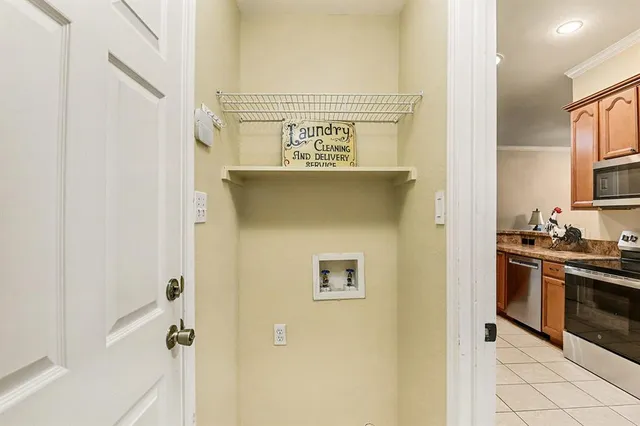 a view of a bedroom with wooden floor and a large window