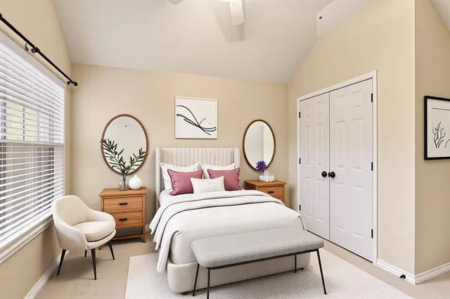 a view of a bedroom with furniture and window
