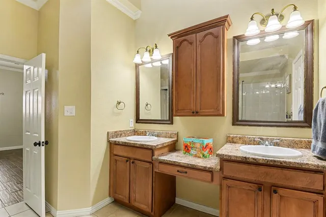 a bathroom with a bathtub shower and a sink