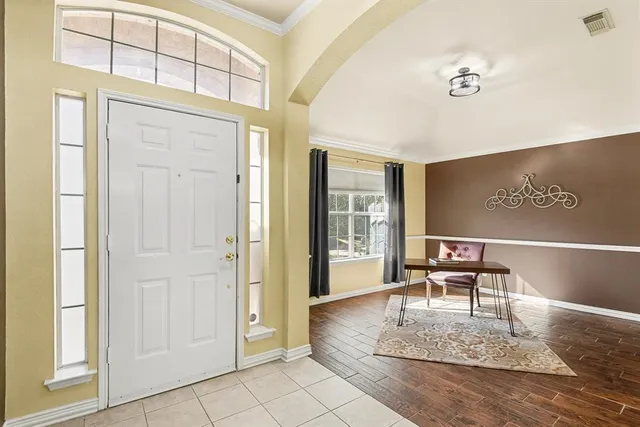 a view of a dining room with furniture and window