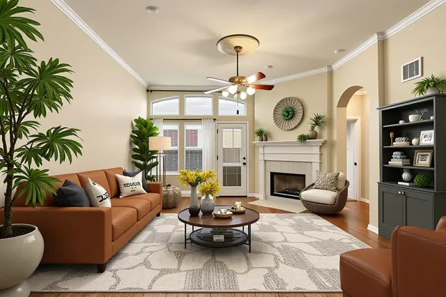 a living room with furniture a fireplace and a chandelier