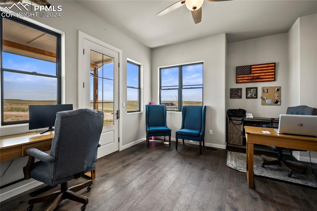 24365 Murphy Road Calhan, CO 80808 - Photo 12 of 50 a view of a workspace with furniture and a window