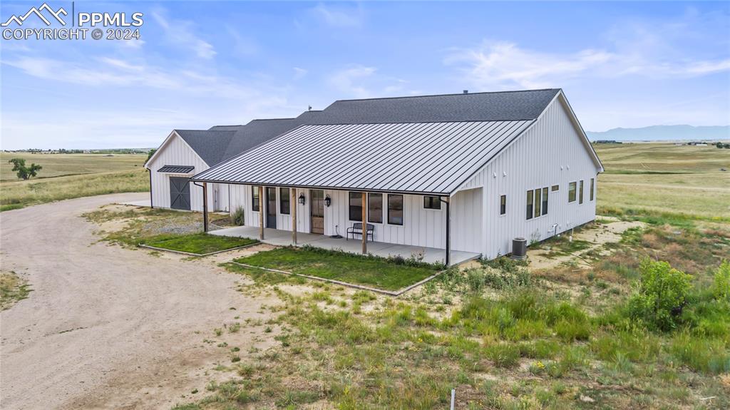 24365 Murphy Road Calhan, CO 80808 - Photo 3 of 50 a view of a house with pool and a yard