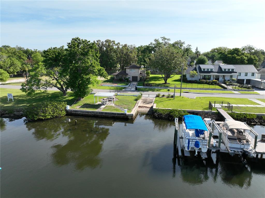 2515 North Riverside Drive Tampa, FL 33602 - Photo 11 of 19 a view of swimming pool with outdoor seating and lake
