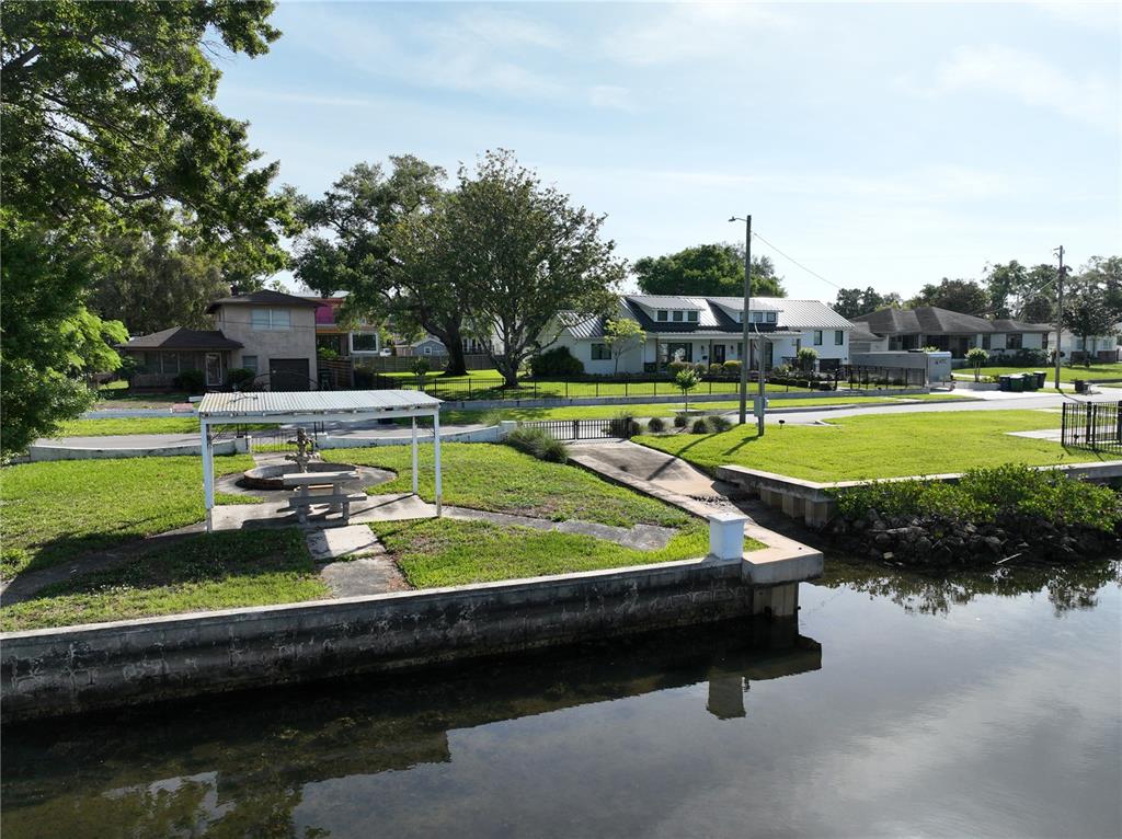 2515 North Riverside Drive Tampa, FL 33602 - Photo 17 of 19 a view of a swimming pool with a yard and furniture