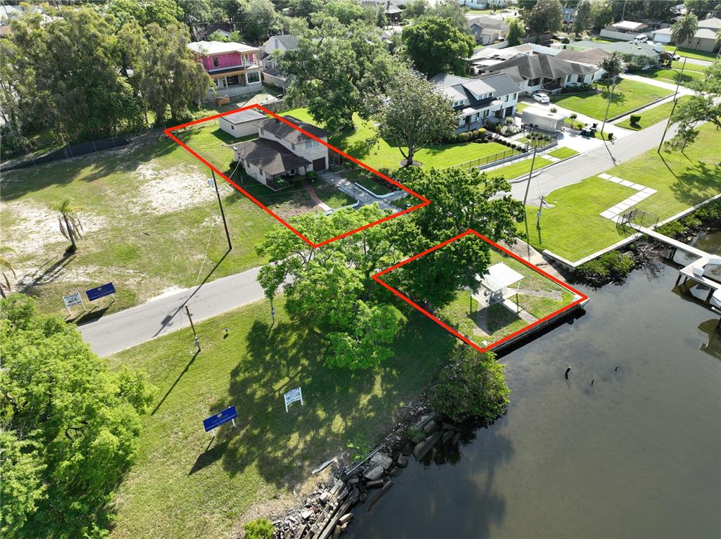 2515 North Riverside Drive Tampa, FL 33602 - Photo 4 of 19 an aerial view of a house with a garden and lake view