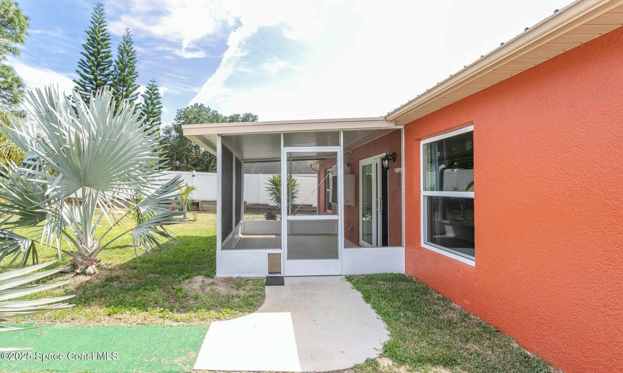 6485 Orchid Avenue Cocoa, FL 32927 - Photo 20 of 24 a front view of a house with garden
