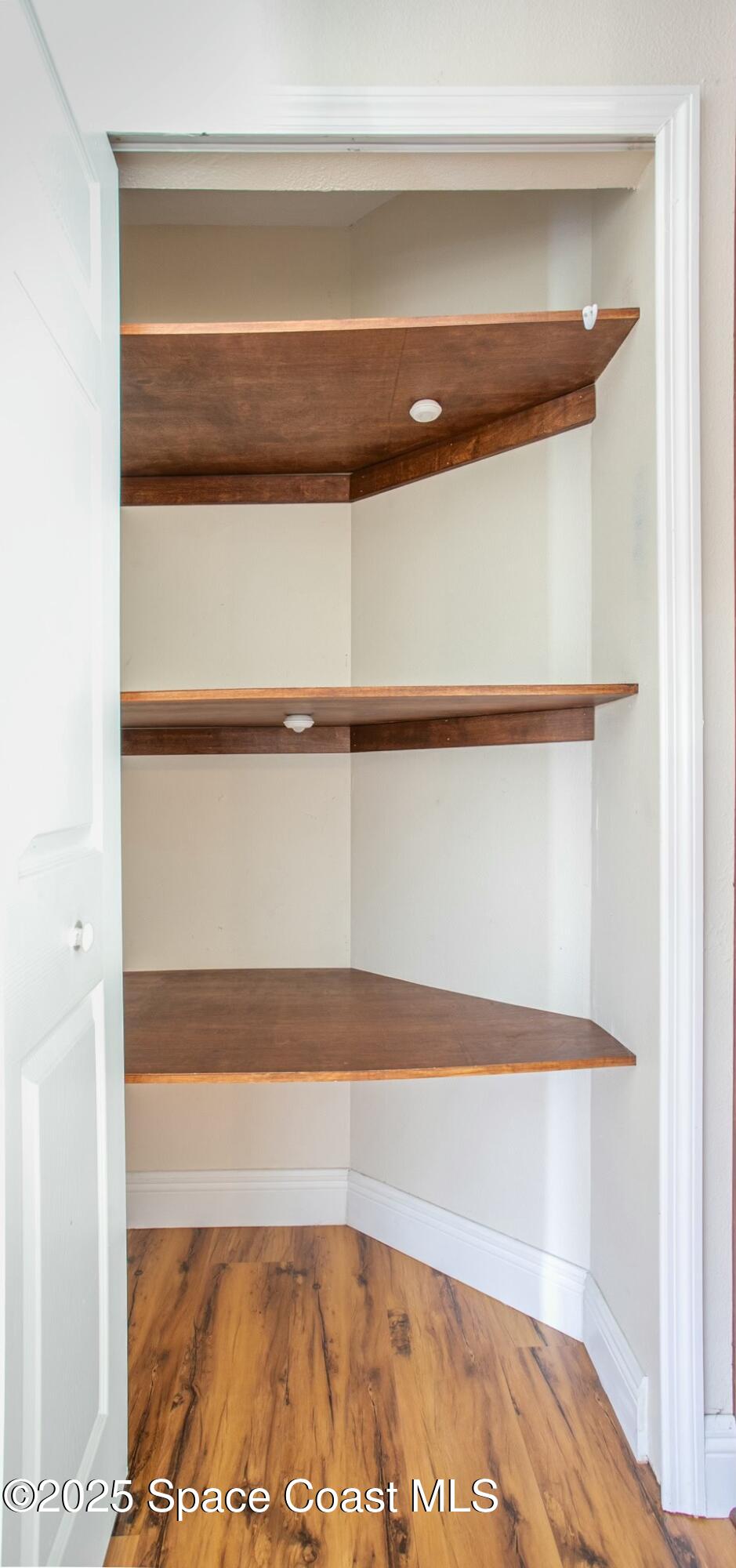 6485 Orchid Avenue Cocoa, FL 32927 - Photo 10 of 24 a view of walk in closet with clothes