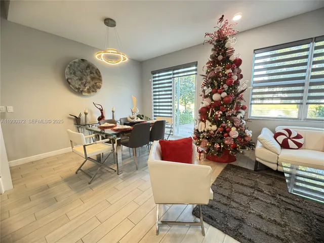 a spacious bedroom with a bed and a flat screen tv