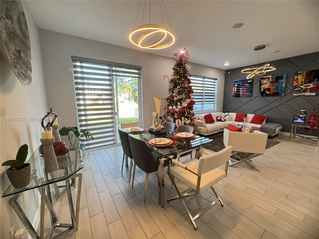 a bathroom with a double vanity sink mirror and toilet