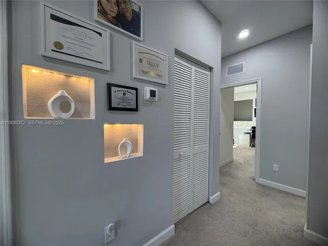 a view of a patio with couches and potted plants