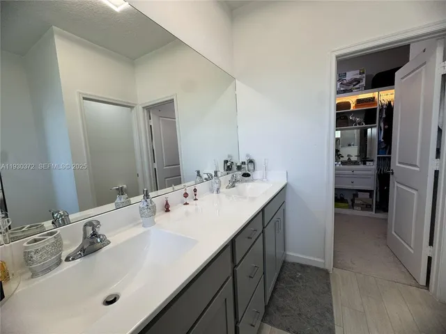 an aerial view of a house with garden space and street view