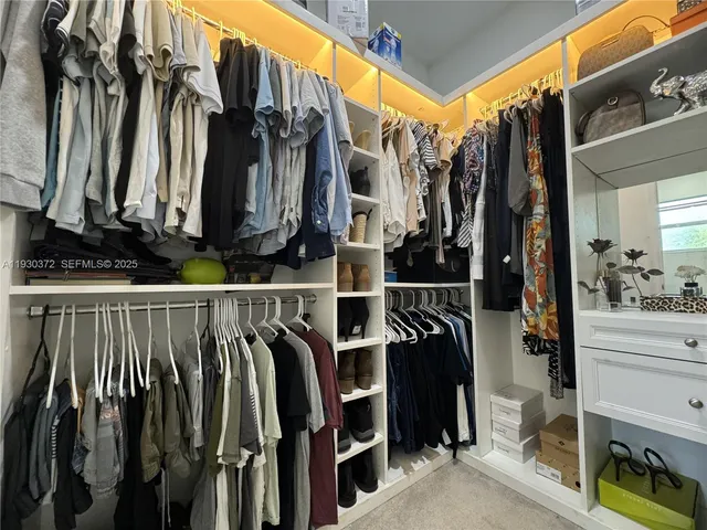 a view of a patio with table and chairs with wooden floor and fence