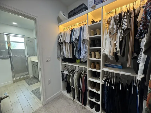 a view of a dining table and chairs in the patio