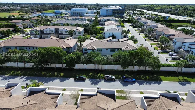 an aerial view of residential houses with outdoor space