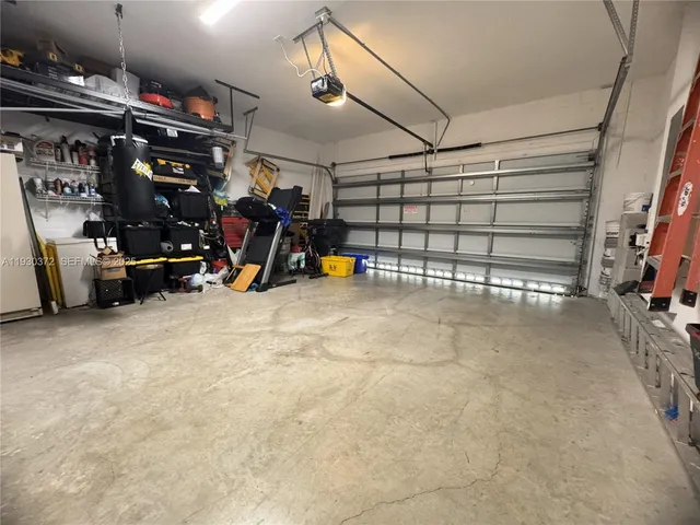 a view of a lake with a floor to ceiling window