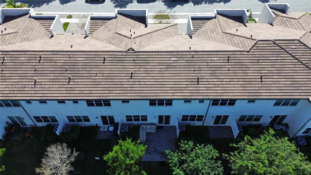 an aerial view of a house with lake view