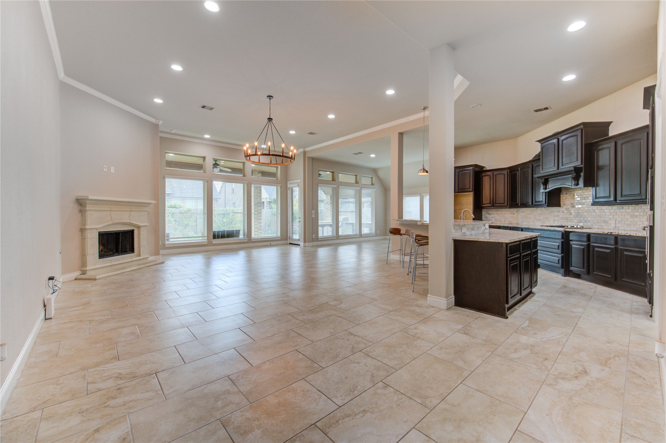 29103 Erica Lee Court Katy, TX 77494 - Photo 13 of 49 a large white kitchen with a large counter top and stainless steel appliances