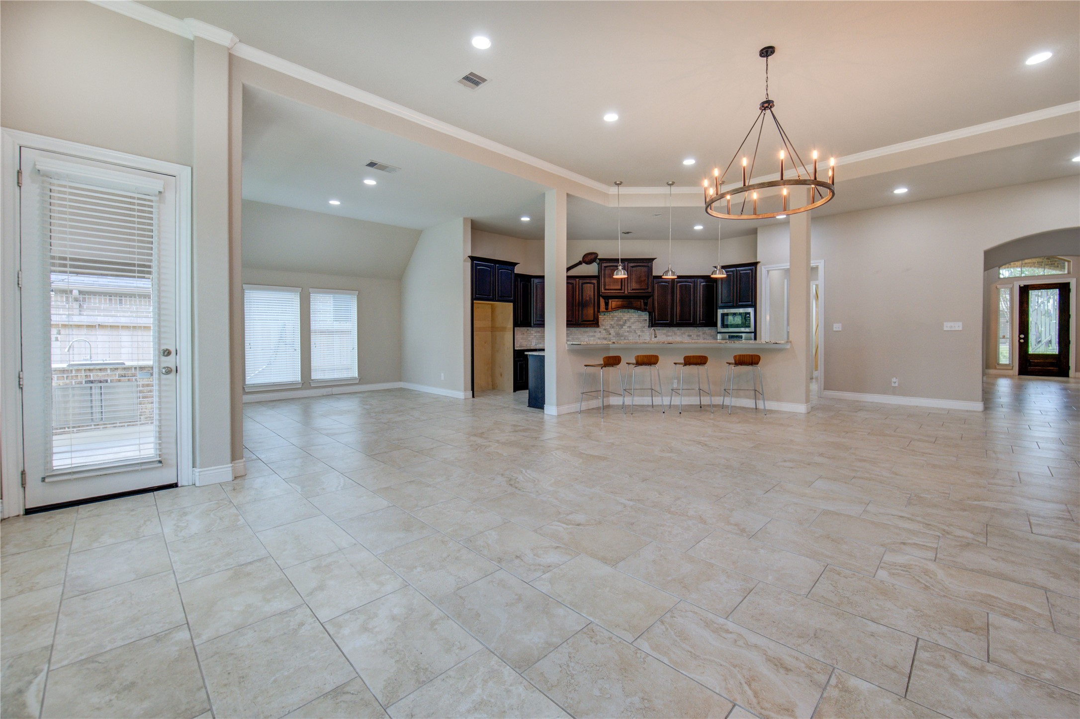 29103 Erica Lee Court Katy, TX 77494 - Photo 14 of 49 an empty room with chandelier and stainless steel appliances