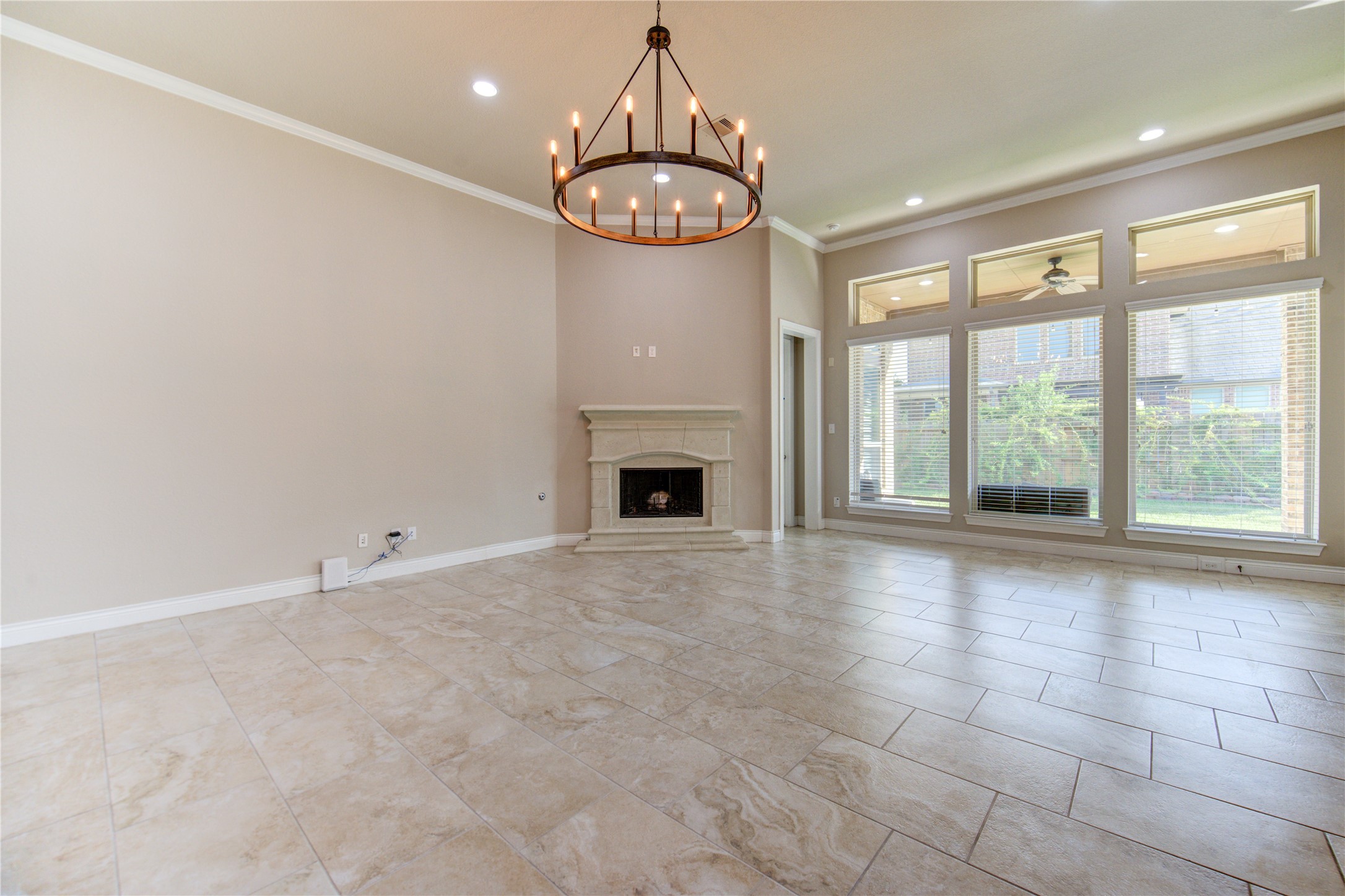 29103 Erica Lee Court Katy, TX 77494 - Photo 16 of 49 a view of an empty room with a fireplace and a window
