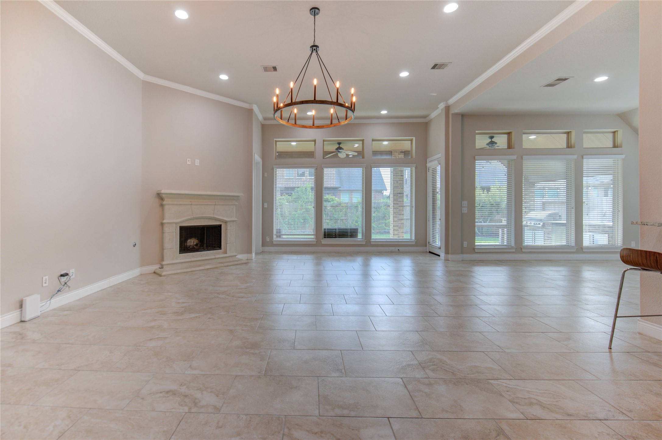 29103 Erica Lee Court Katy, TX 77494 - Photo 17 of 49 a view of an empty room with a fireplace and a floor to ceiling window