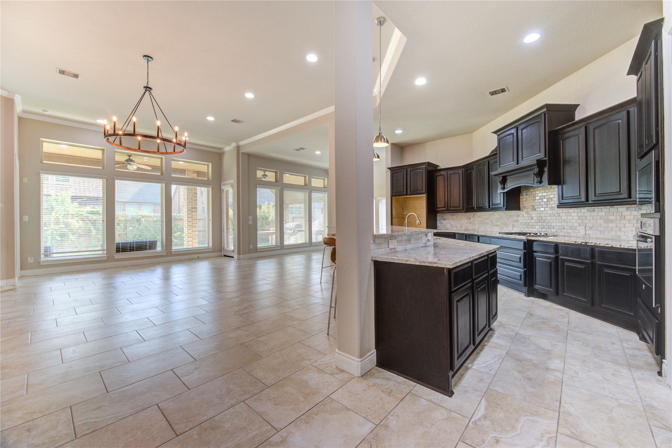 29103 Erica Lee Court Katy, TX 77494 - Photo 19 of 49 a large kitchen with stainless steel appliances granite countertop a stove and a wooden cabinets