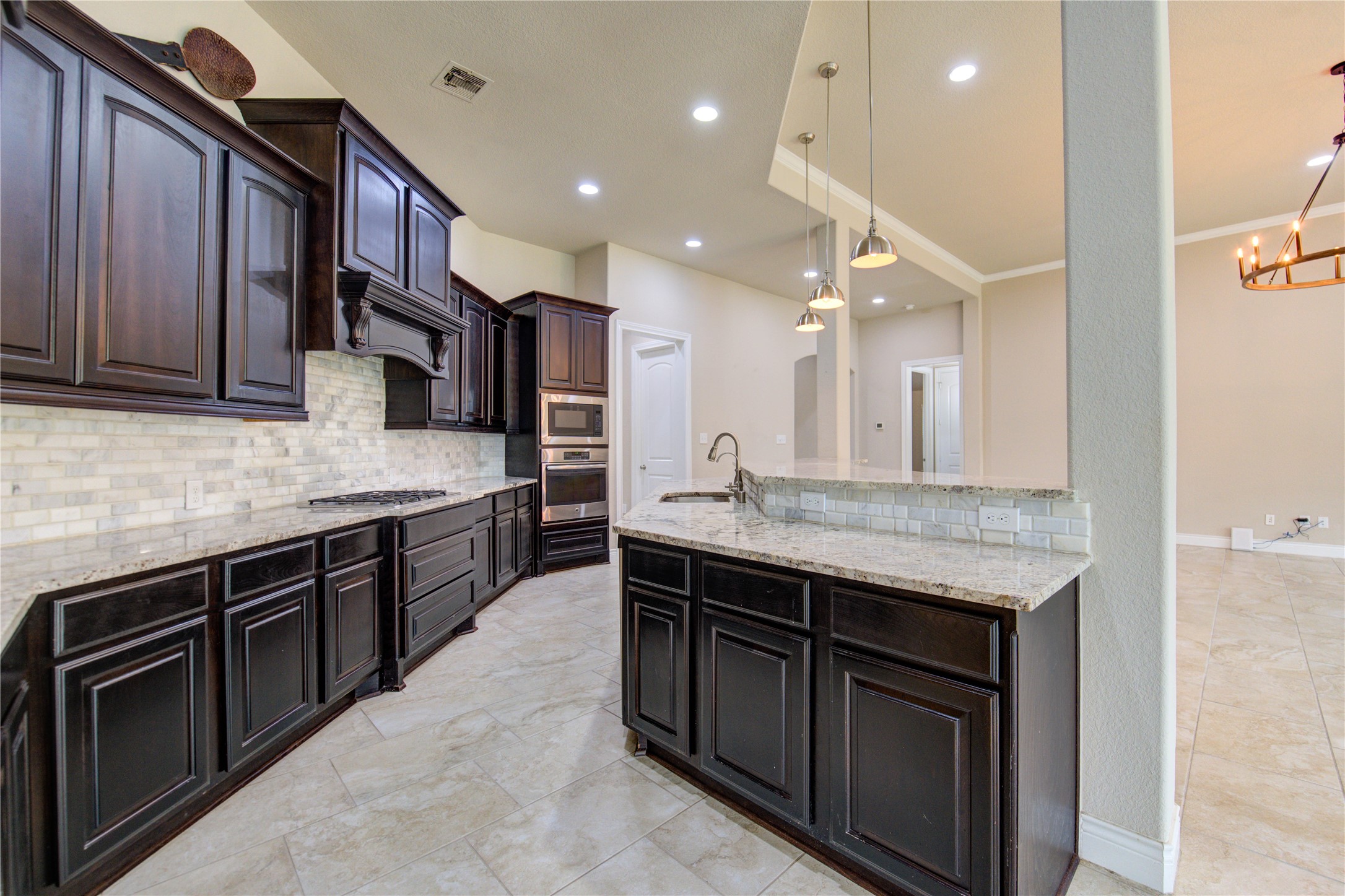 29103 Erica Lee Court Katy, TX 77494 - Photo 22 of 49 a open kitchen with stainless steel appliances granite countertop a stove refrigerator and cabinets