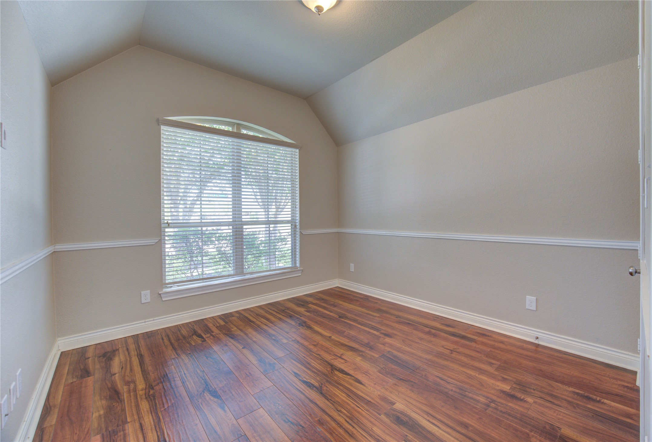 29103 Erica Lee Court Katy, TX 77494 - Photo 23 of 49 an empty room with wooden floor and windows