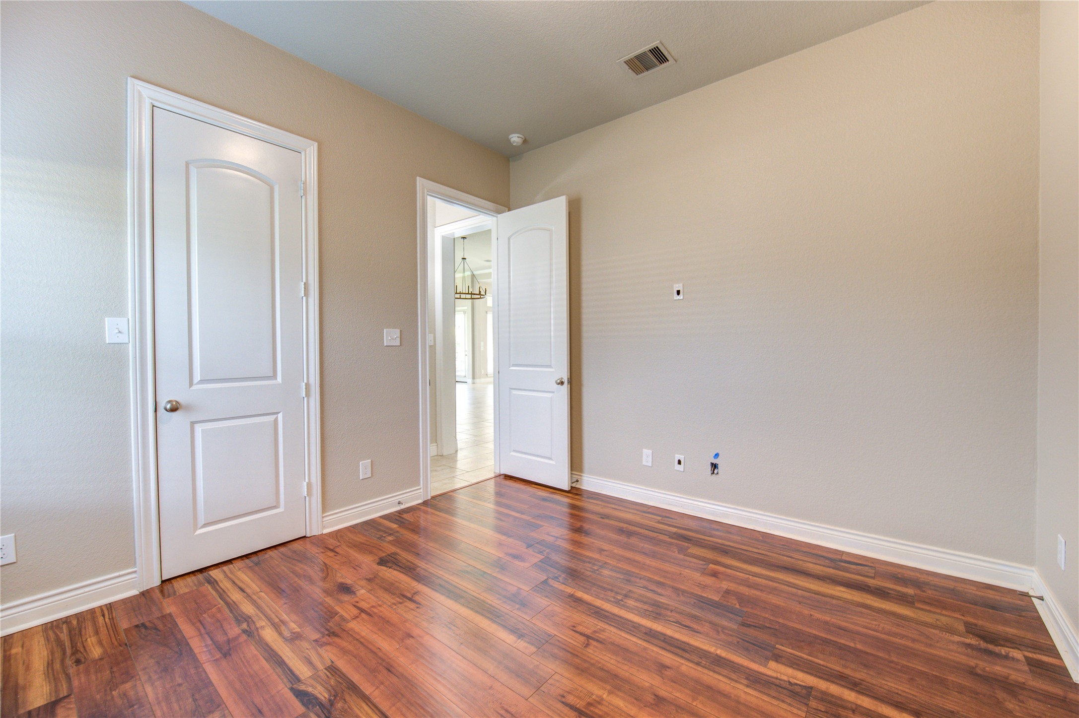 29103 Erica Lee Court Katy, TX 77494 - Photo 27 of 49 a view of an empty room with wooden floor