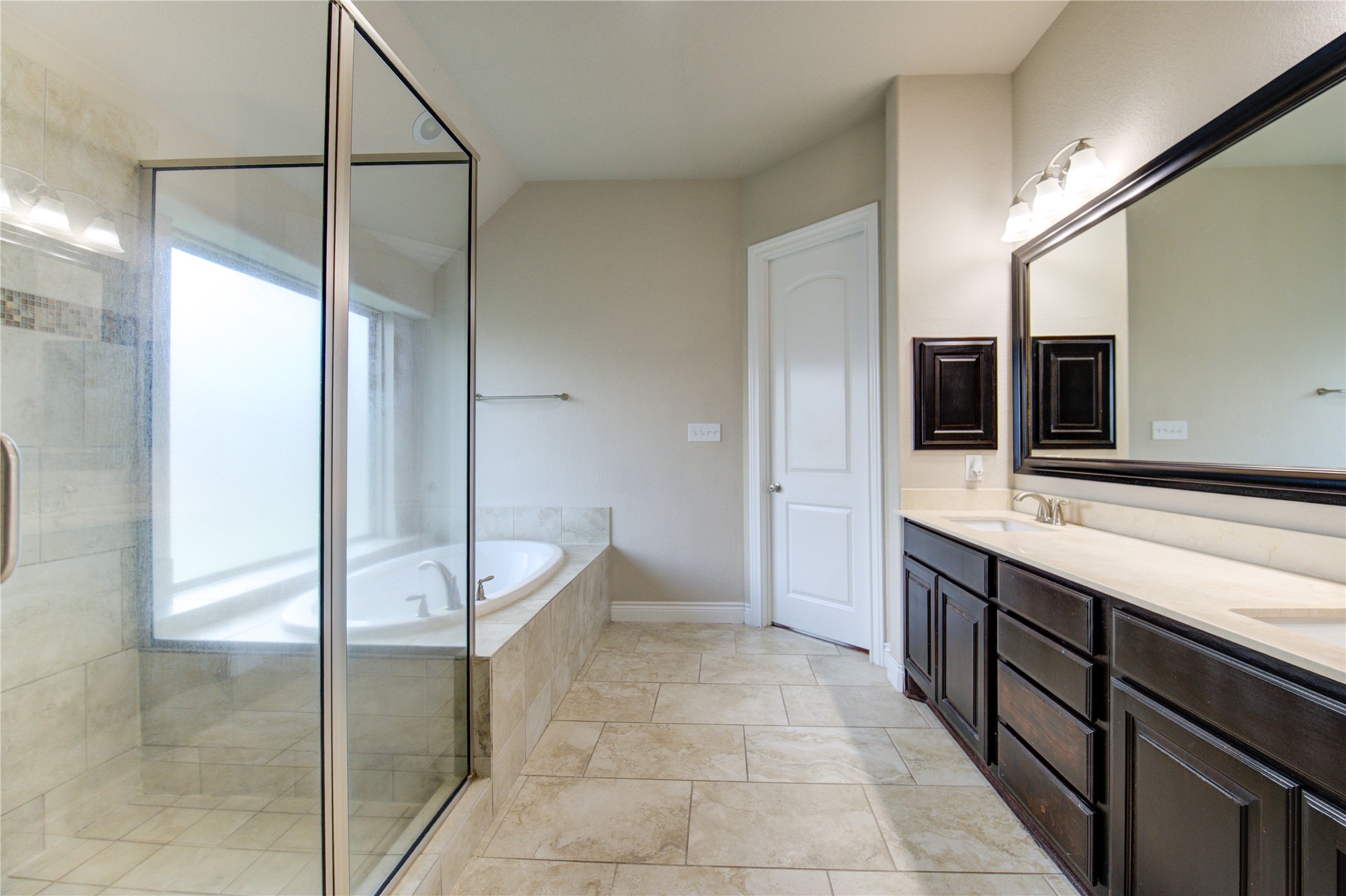 29103 Erica Lee Court Katy, TX 77494 - Photo 36 of 49 a spacious bathroom with a granite countertop sink a mirror and a shower