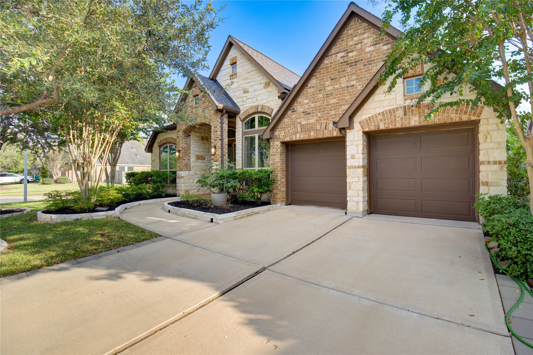 29103 Erica Lee Court Katy, TX 77494 - Photo 4 of 49 a front view of a house with a yard and a garage